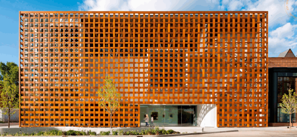 Exterior view of the Aspen Art Museum with modern architectural design, large glass windows, and the surrounding Aspen streetscape.