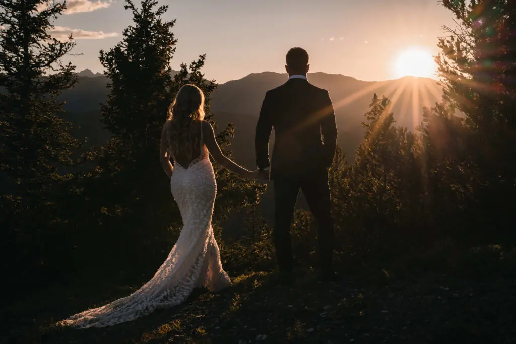 Bride and groom at one of the top wedding venues in Aspen with mountain views behind them