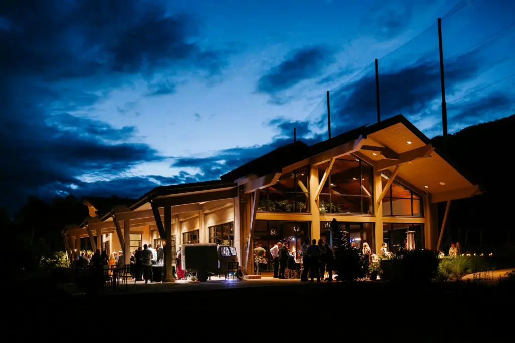Vail Golf and Nordic Clubhouse with warm interior lighting and mountain views.