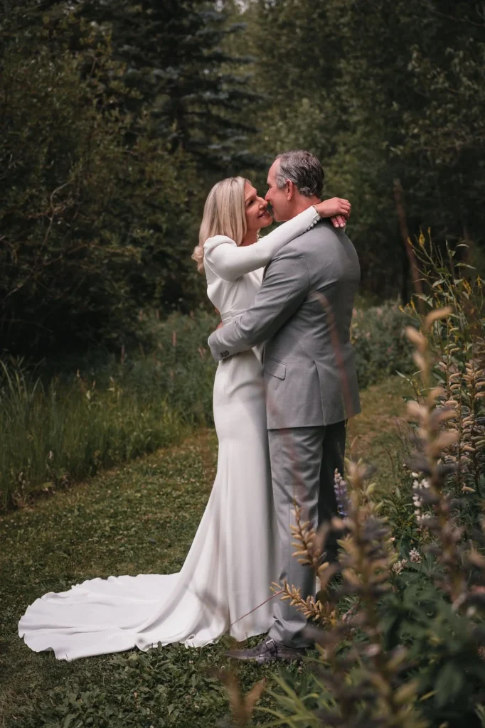 Couple embracing during emotional Bosq Aspen wedding ceremony