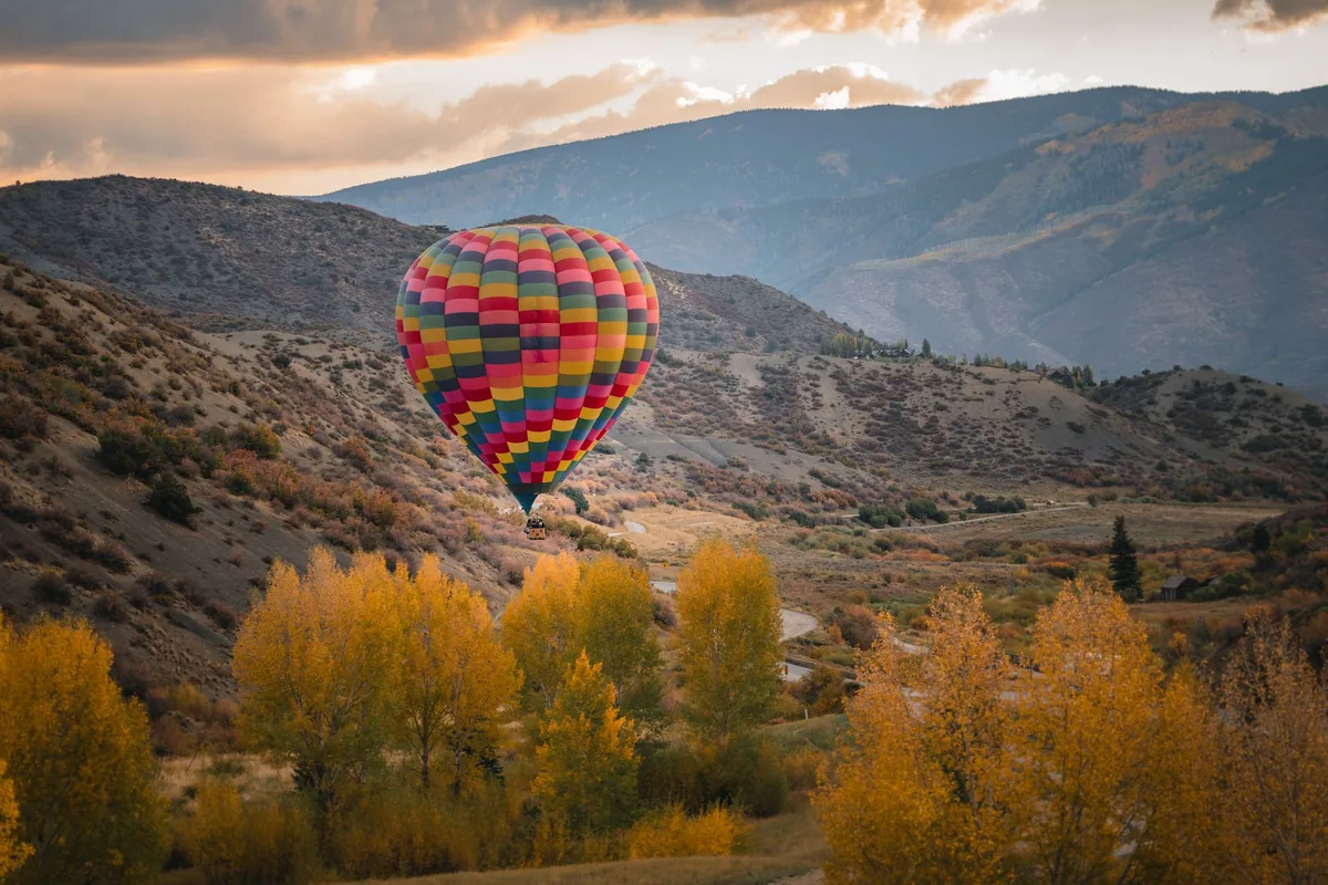 Hot air balloon over fall aspens in the Snowmass valley