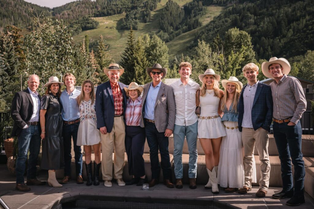 Wedding guest holding a framed instant print from a luxury Aspen wedding reception
