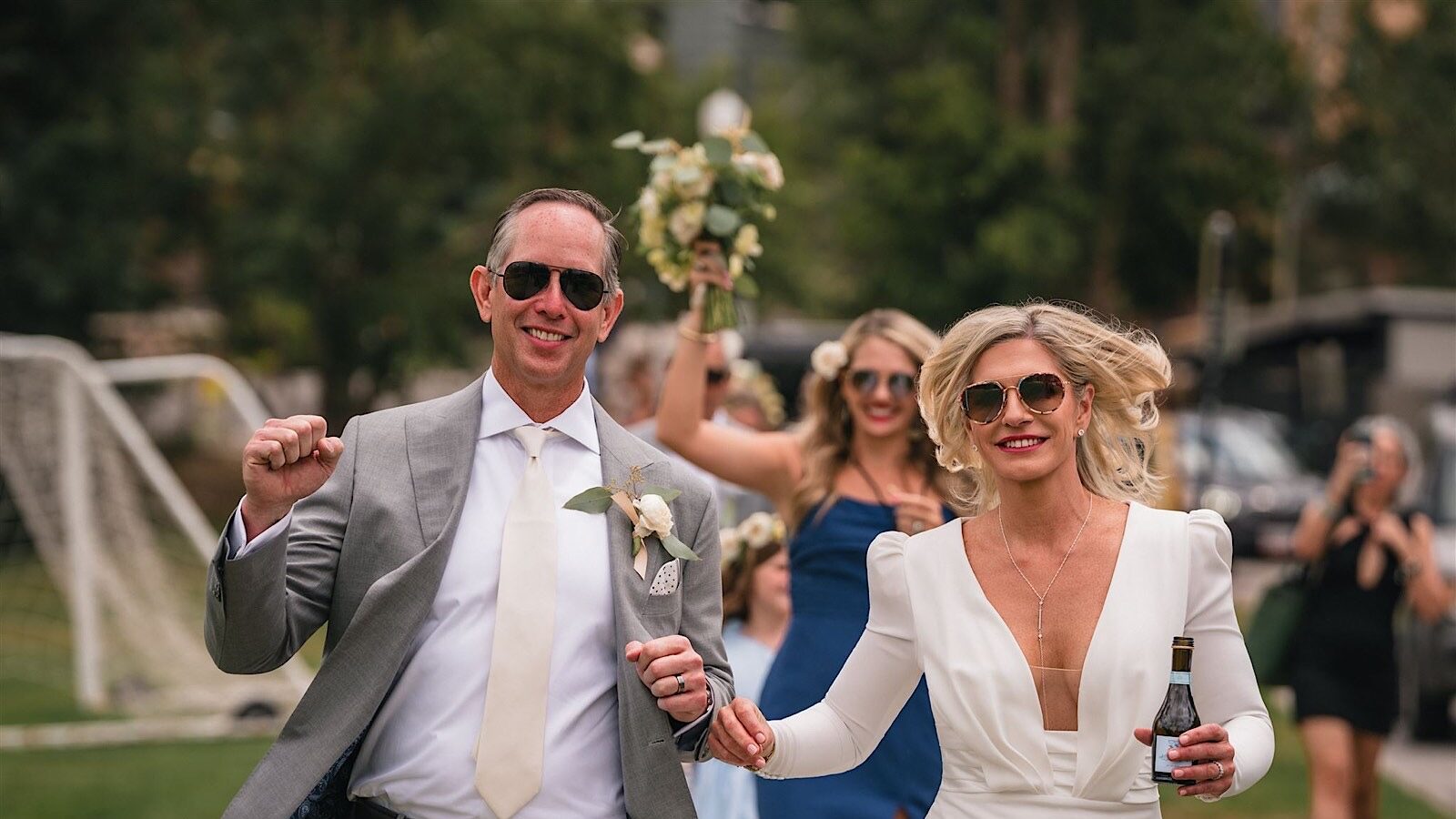 Joyful wedding guests at a luxury Aspen reception experiencing instant photo sharing during cocktail hour