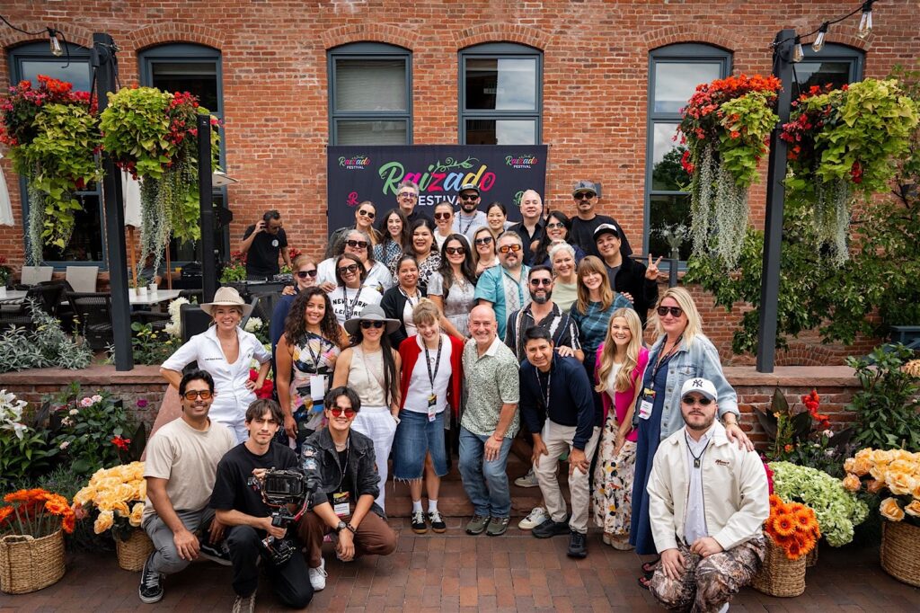 Corporate event guests in Aspen receiving instantly delivered professional photos from a roaming photographer