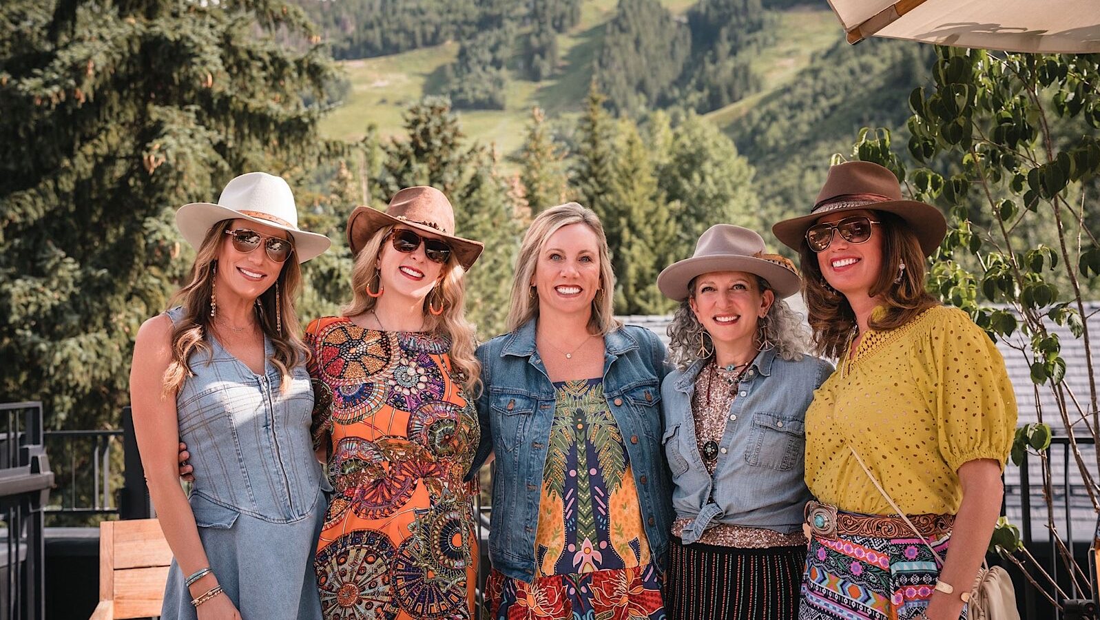 Elegant luxury event setup at an Aspen venue with roaming photographer — no photo booth in sight