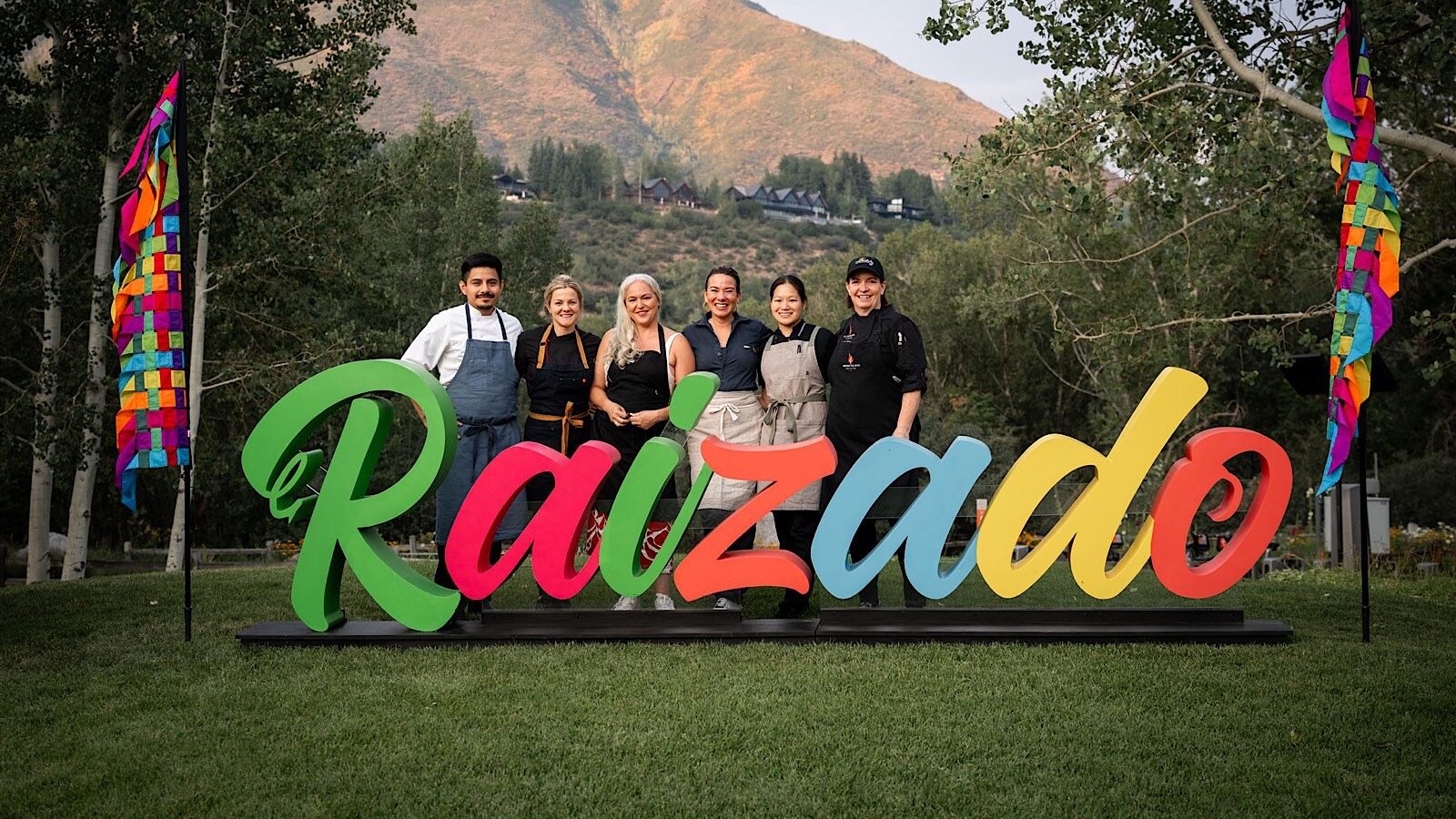 Aspen event planner coordinating a luxury reception while a roaming photographer seamlessly captures guest moments