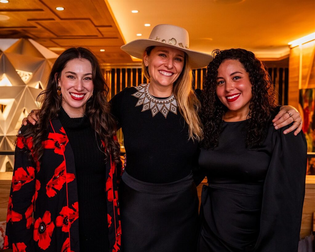 Candid guest interaction at a high-end Aspen event captured naturally without staged photo booth setup
