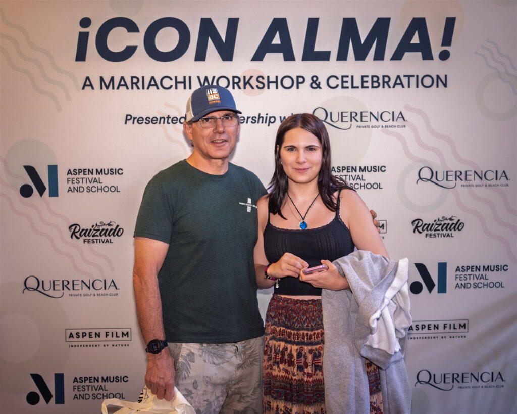 Guests receiving instant prints from Aspen event photography instant printing at the Raizado celebration