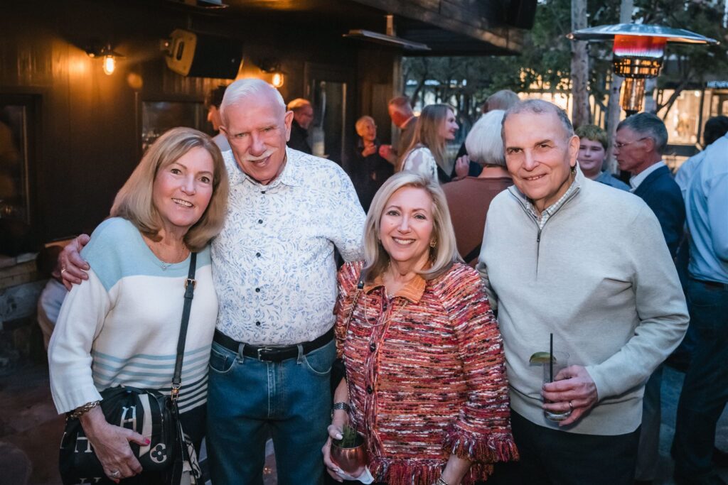 Instant event photography in action as a photographer roams a celebration in Aspen