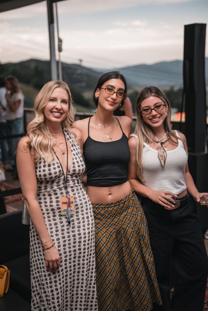 Group of concert attendees receiving instant prints through Aspen event instant photo sharing