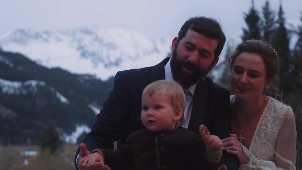 Rebecca Javier and young son family portrait at Pine Creek Cookhouse Ashcroft Colorado winter wedding with mountains